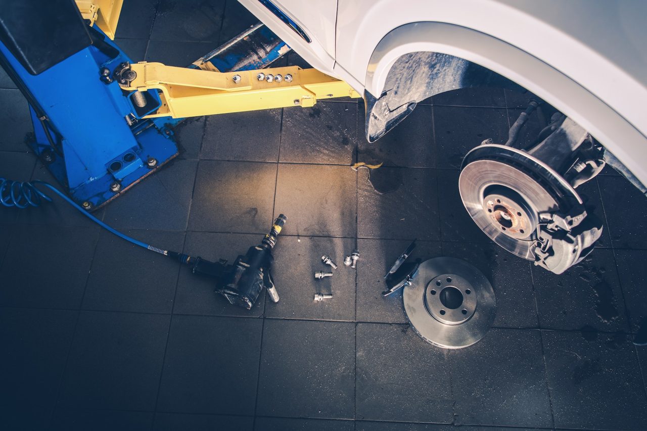 Close-up of brake discs and pads during inspection