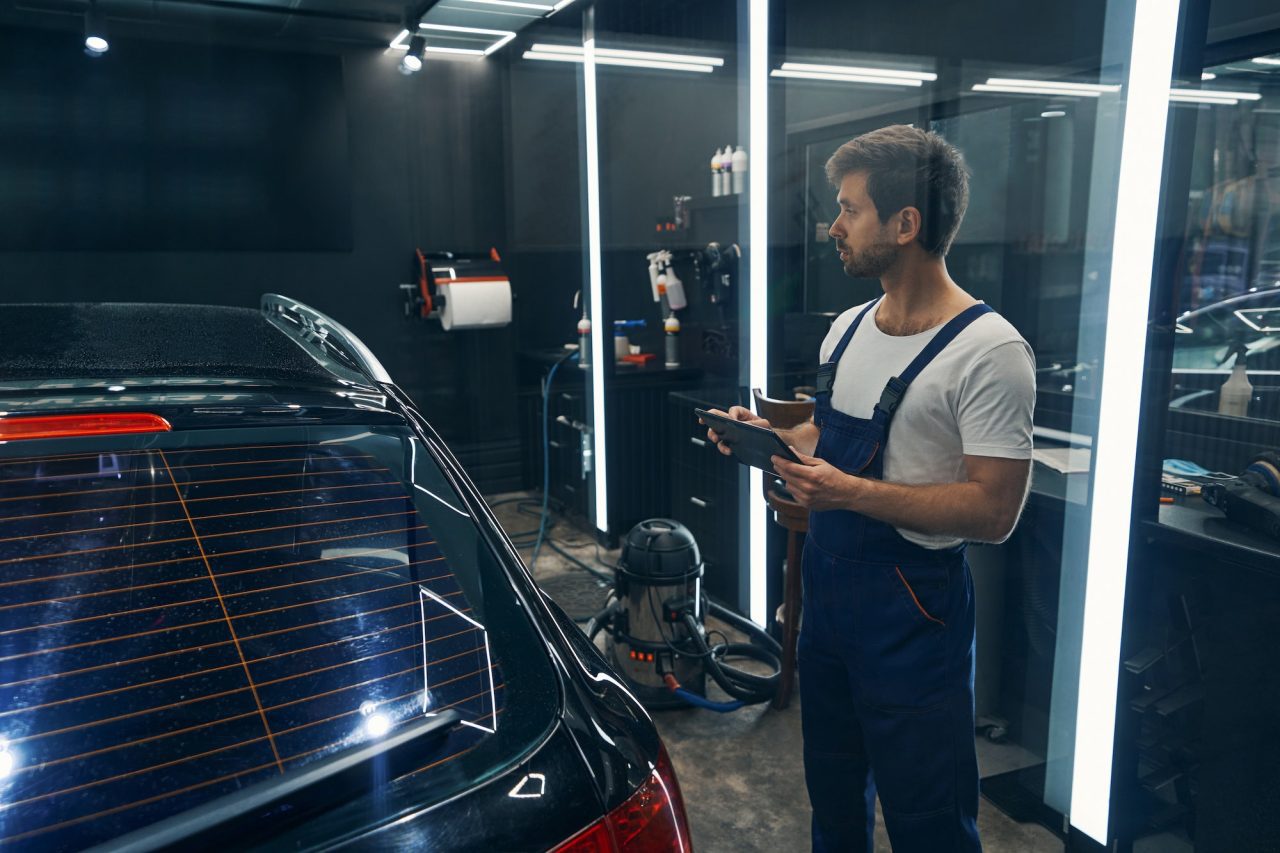 Technician assessing bumper repair options