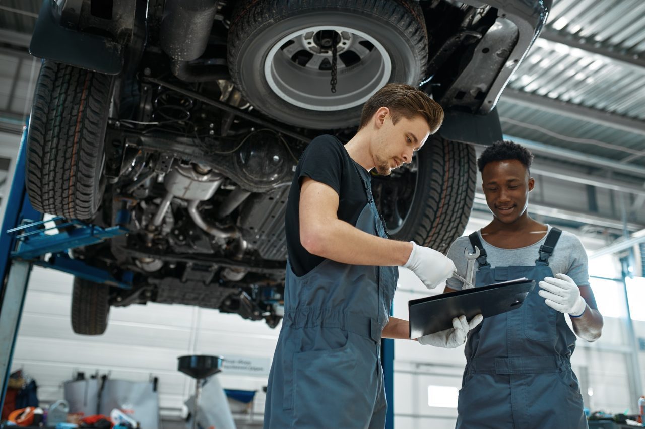 Mechanic doing a pre-trip vehicle checklist